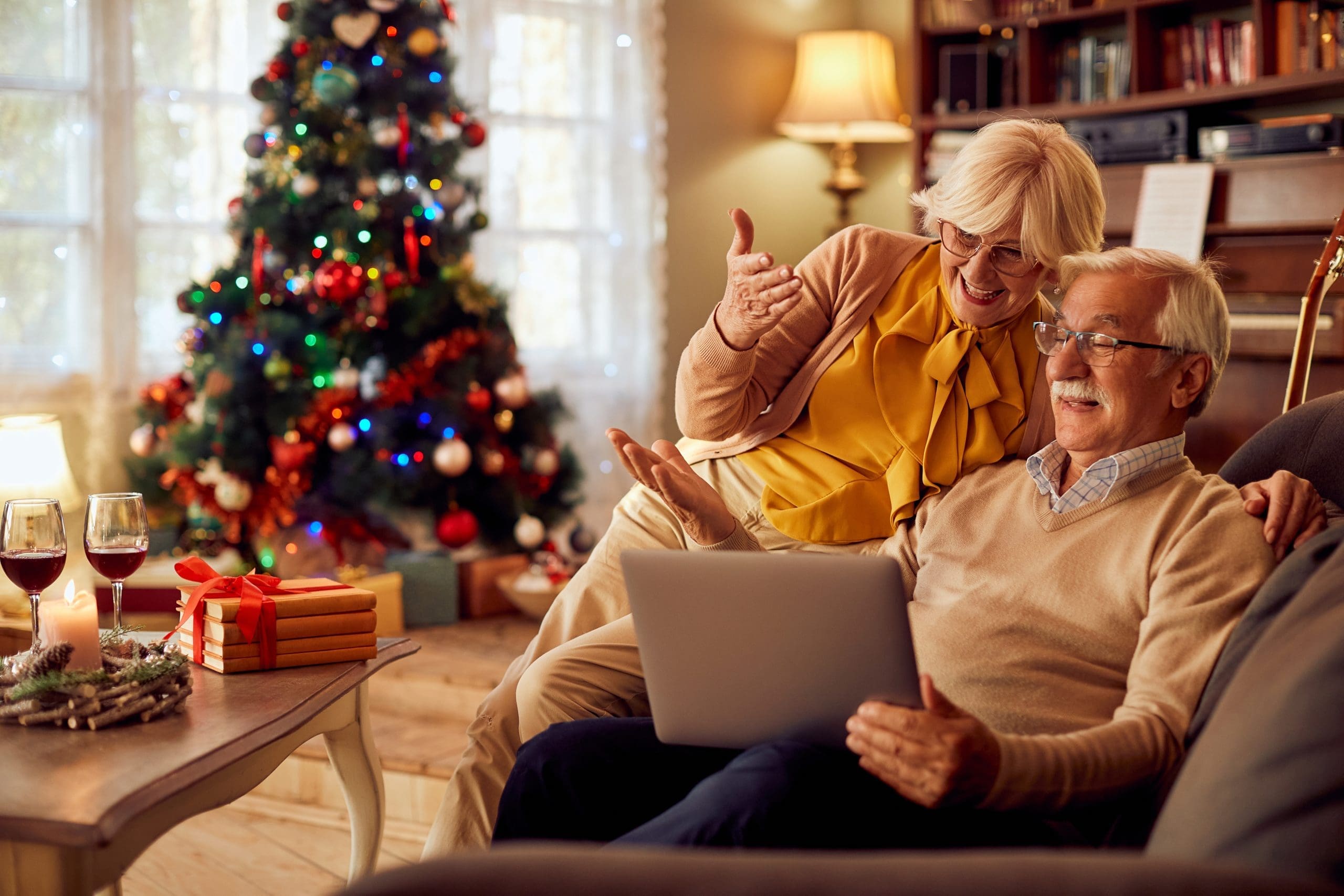Happy couple on the computer at Christmas